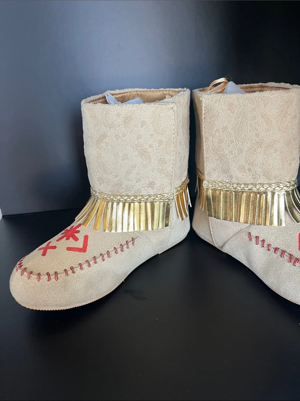 Disney Beige Moccasin Boots with Gold Fringe and Red Embroidery